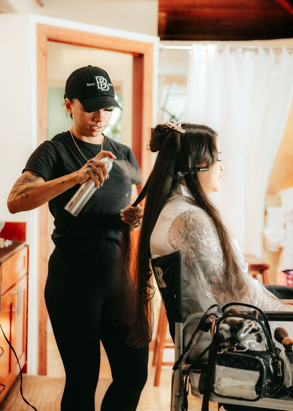 Bride in the hair-and-makeup chair on the wedding morning